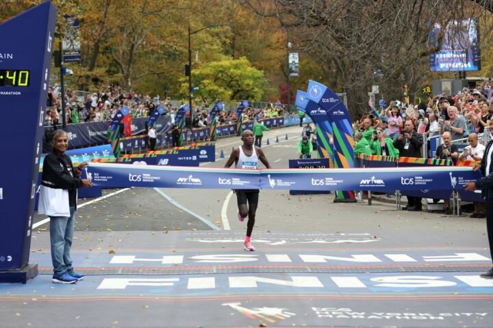 Evans Chebet about to cross the 2022 New York City Marathon finish line, the clock reads 2:08:40