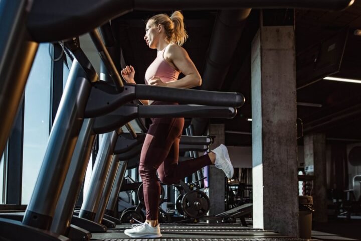 Woman running on a treadmill in the gym